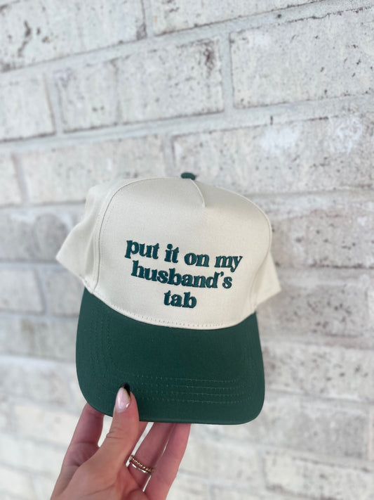 Put It On My Husbands Tab Trucker Hat