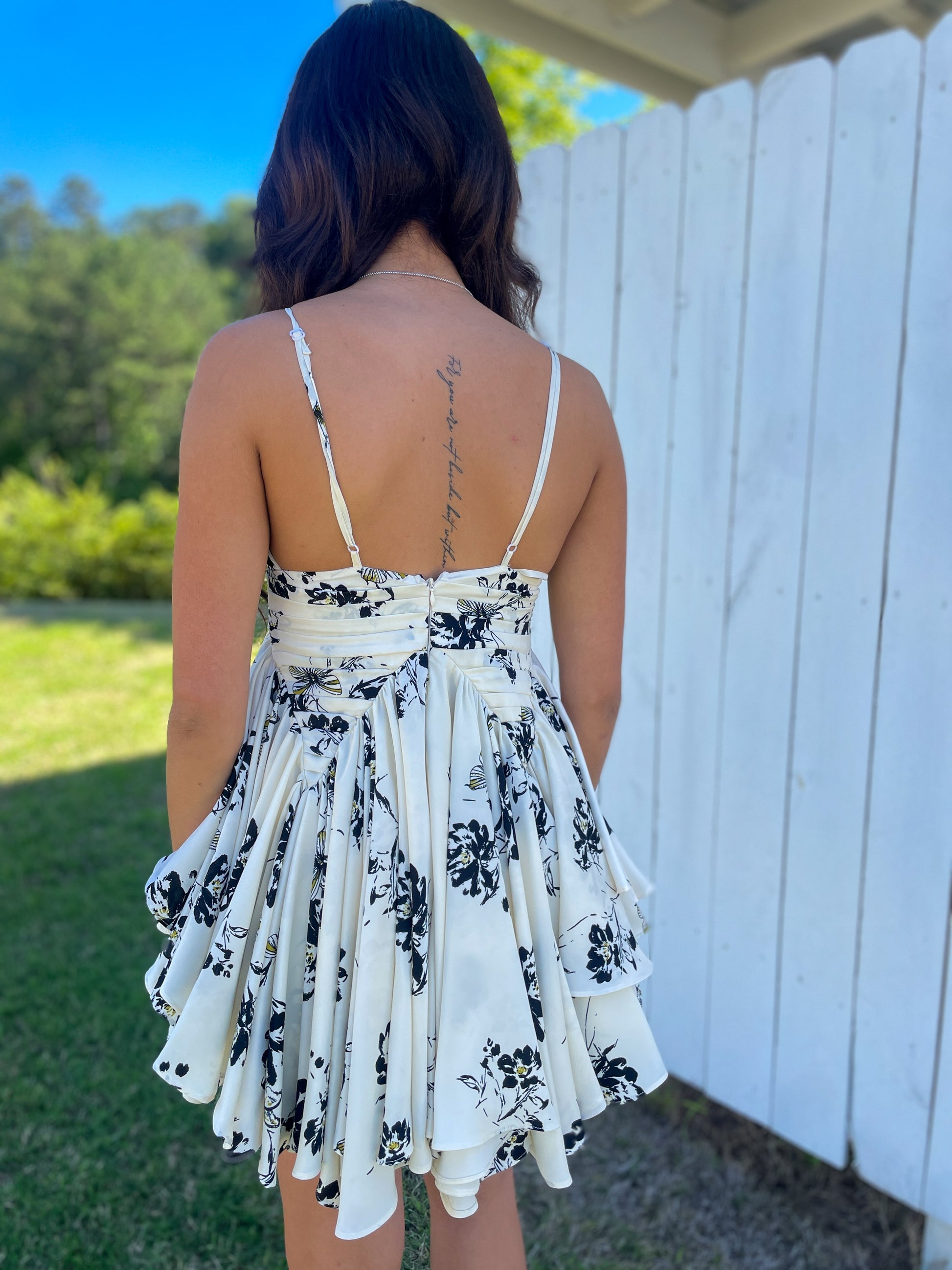 kiara mini dress One of our favorite pieces from the HERANZA collection, the Kiara Mini Dress is a one-size design featuring soft petal details, creating a feminine and timeless statement